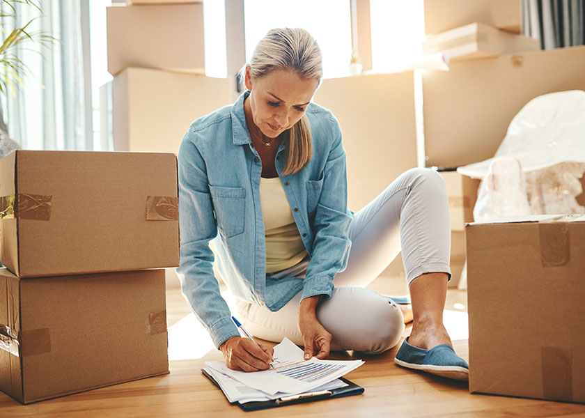 woman writing a checklist for retirement planning